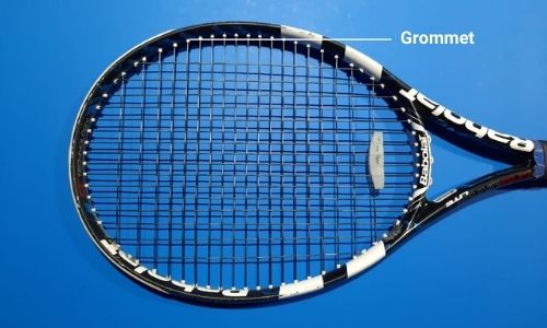 Grommet, through which strings are inserted in a head